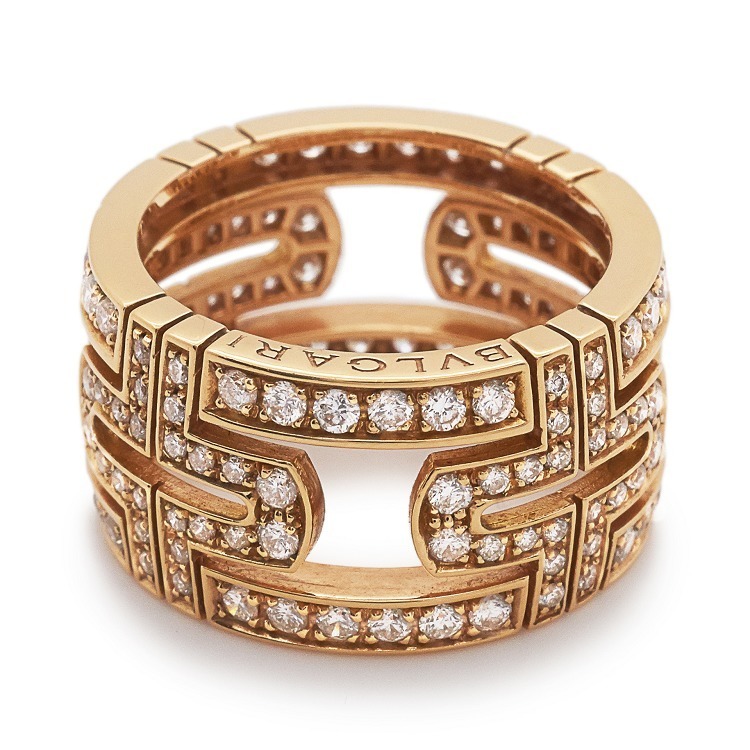 Detail shot of the Bulgari Parentesi ring's diamond-set rose gold segments, emphasizing the signature bracket motif