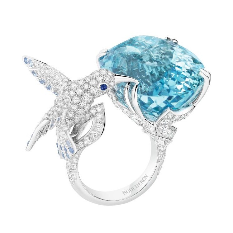 Side profile of Boucheron Hopi Hummingbird Ring, showcasing intricate diamond-set plumage and a vibrant central gemstone.