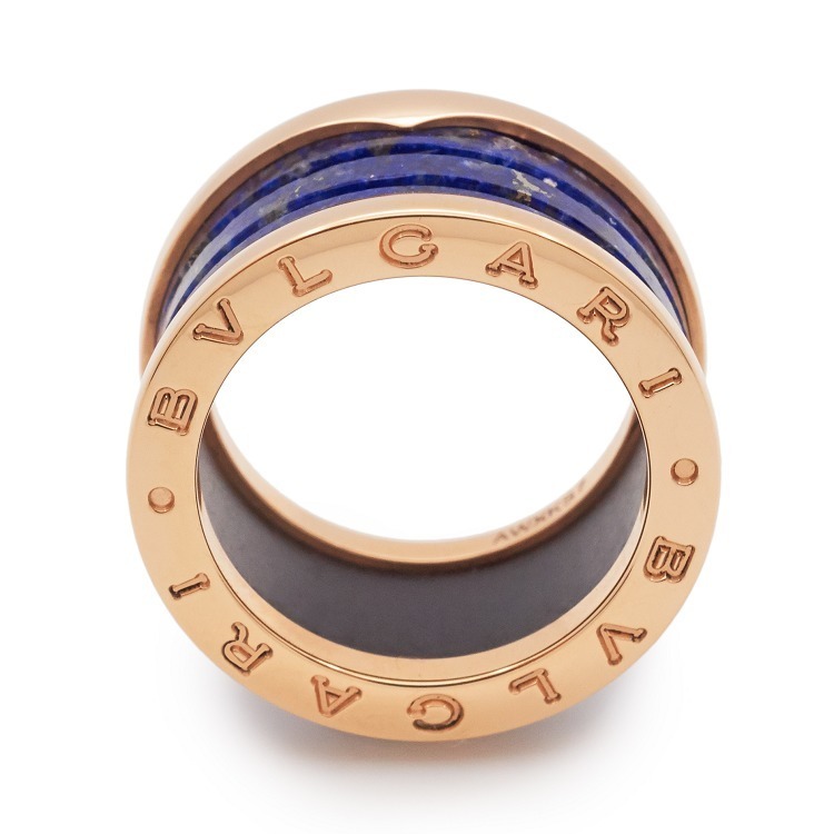Detailed view of the Bulgari B.Zero1 ring's side profile, revealing the 'BVLGARI BVLGARI' engraving on the rose gold edges.