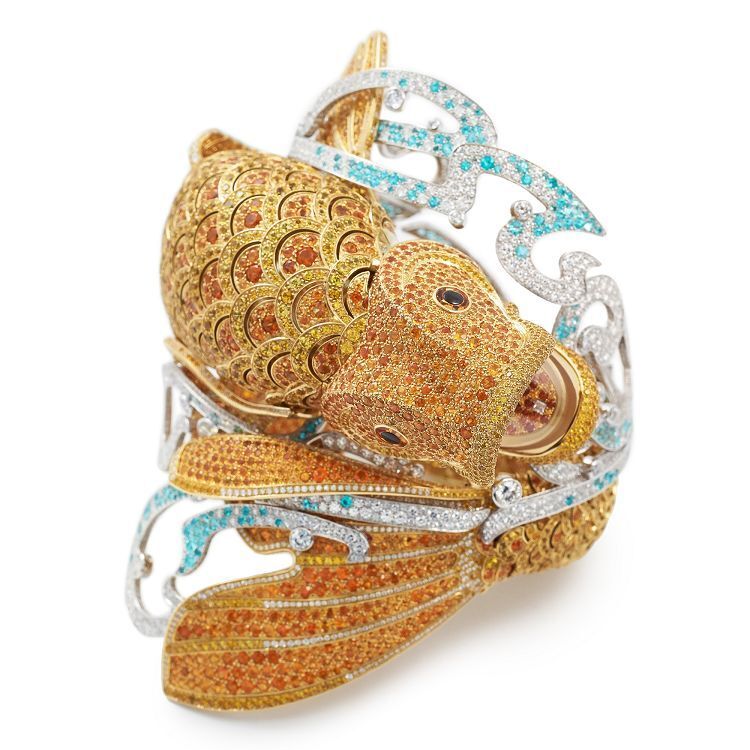 Detailed view of the Van Cleef & Arpels Carpe Koï bracelet watch, highlighting the intricate setting of yellow sapphires and spessartite garnets forming the koi's scales.