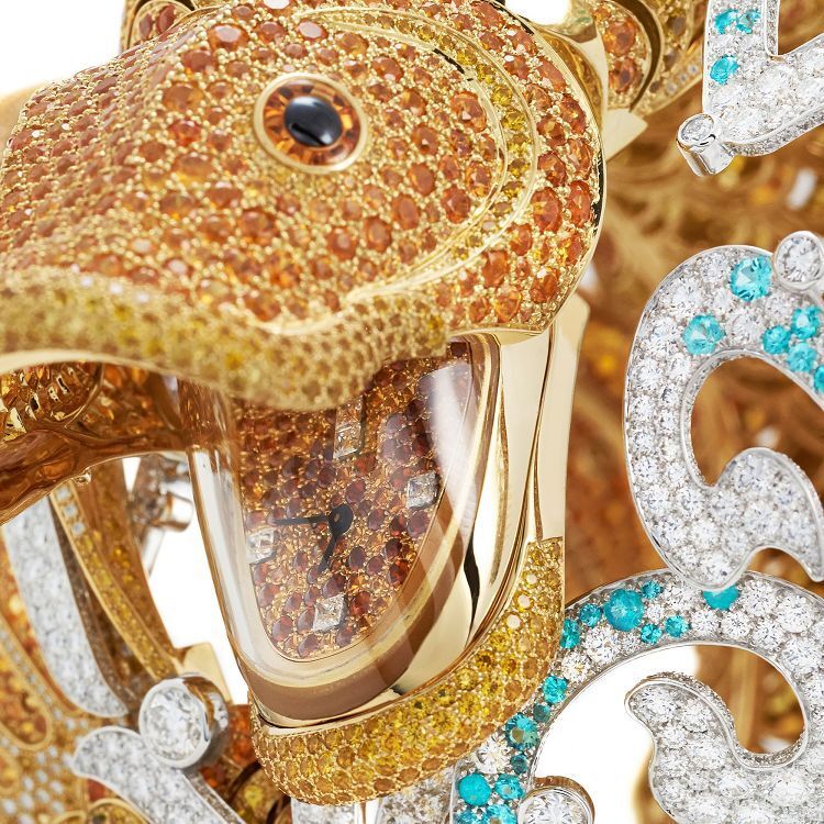 Overhead perspective of the Van Cleef & Arpels Carpe Koï bracelet watch, illustrating the graceful flow of the koi's body and the shimmering white gold waves set with diamonds and Paraiba tourmalines.