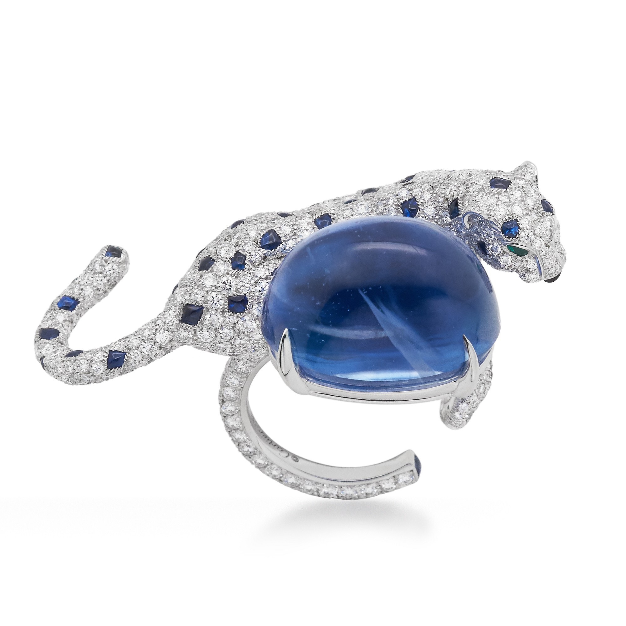 Close-up of the Cartier Panthère De Cartier sapphire ring, showcasing the central oval cabochon sapphire and diamond-set leopard sculpture.
