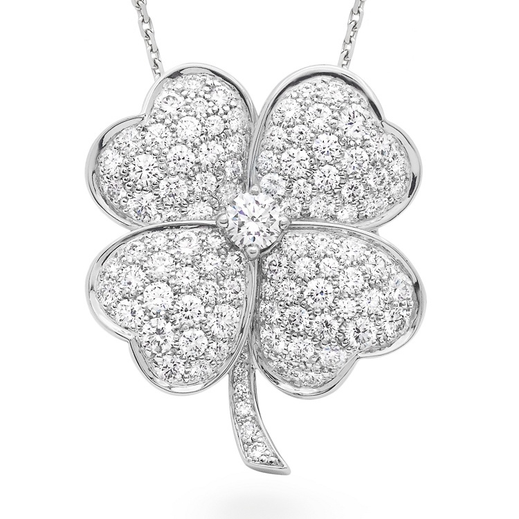 Front view of the Van Cleef & Arpels Cosmos pendant brooch, featuring a four-leaf clover design crafted from platinum and pavé-set with brilliant-cut diamonds.